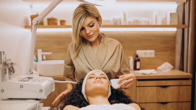 Woman at cosmetologist making beauty procedures
