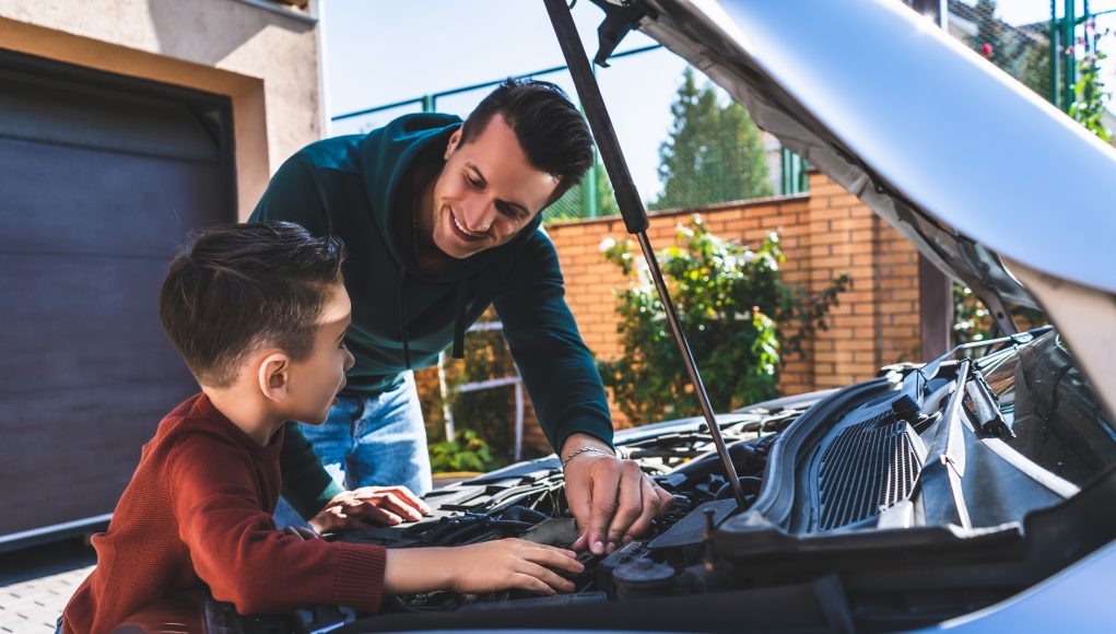 The,Father,And,Son,Fixing,The,Car