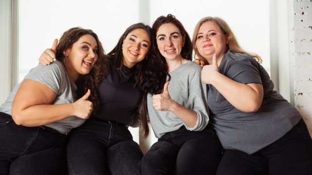 young-caucasian-women-casual-clothes-having-fun-together-friends-sitting-near-by-window-laughting-spending-time-together-bodypositive-nutrition-feminism-loving-themself-beauty-concept-1