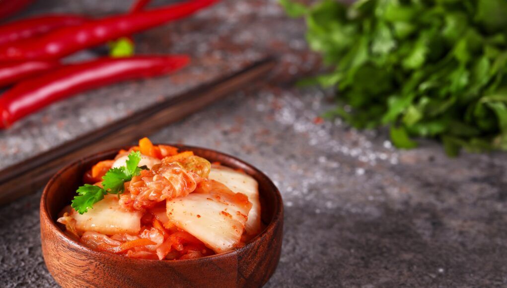 Fermented,Korean,Cabbage,Kimchi,In,A,Wooden,Bowl